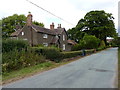 SJ6109 : Roadside cottages in Aston by Richard Law