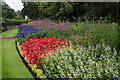 TQ2680 : Colourful flowerbed near Lancaster Gate by Bill Boaden