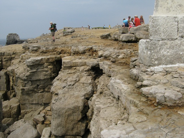 Erosion of cliffs behind Trinity House Warning Marker