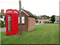 Bus shelter and old telephone box on the green, Middleton