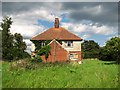 Disused council cottages by Annesons Corner