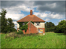 TM4266 : Disused council cottages by Annesons Corner by Evelyn Simak