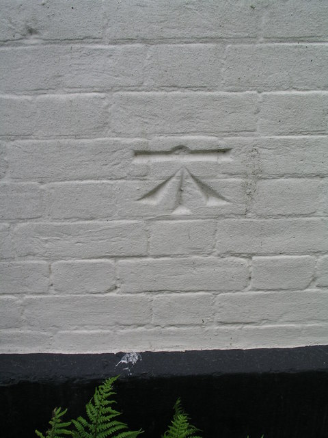 Cut bench mark with bolt on Southwold, United Reformed Church