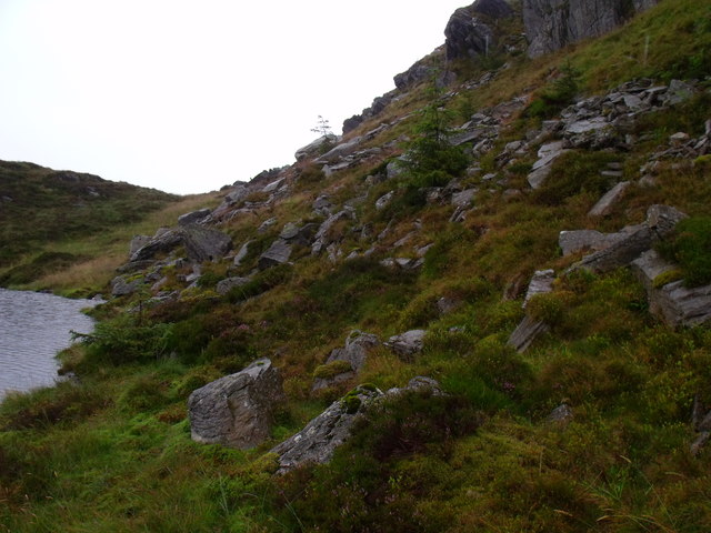 Gloomy rock wall above Binnean nan Gobhar's lochan