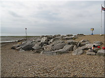 TQ1101 : Sea defence rocks by Sea Lane cafe by Josie Campbell
