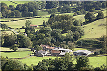 NZ7402 : Looking down on Yew Grange Farm from Glaisdale Rigg by Colin Grice