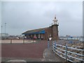 SD4264 : Cafe and lighthouse on the stone jetty, Morecambe by Raymond Knapman