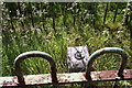 Benchmark block in railing enclosure beside Skipton Road