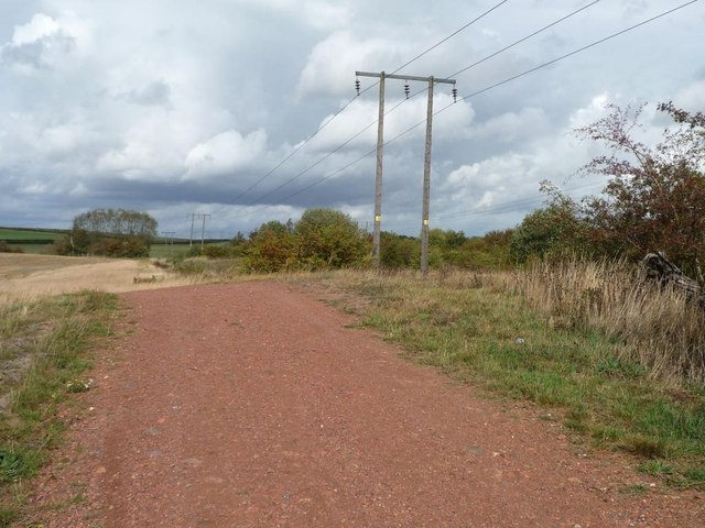 High-voltage poles along the edge of former spoil heap