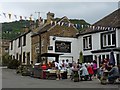 SK2276 : A hog roast outside The Miners Arms, Eyam by Robin Drayton
