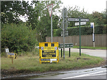 SP2480 : Signs at Four Oaks crossroads,  by Robin Stott