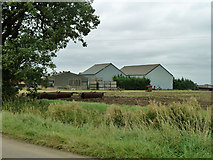 TL6219 : Barns at Puttocks Farm by Robin Webster