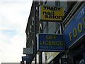 TQ3268 : Shop-signs outside Thornton Heath Station by Christopher Hilton