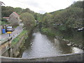 Stream running to pass under road bridge and onto the beach at Sandsend