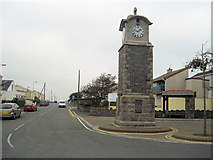 SH3173 : Centre of Rhosneigr showing clock tower by John Firth