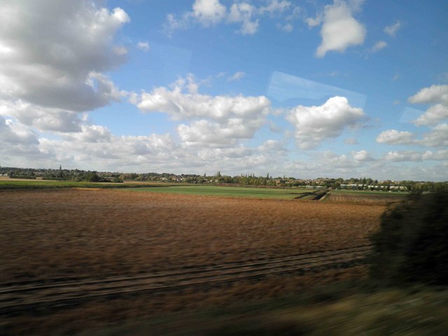 Potato field alongside the East Coast main railway line near Yaxley