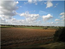 TL1991 : Potato field alongside the East Coast main railway line near Yaxley by Steve  Fareham