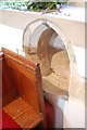 TQ5012 : Piscina hidden by pew, Laughton church by Julian P Guffogg