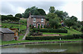 SJ6374 : Cottage with garden by the canal near Barnton, Cheshire by Roger  Kidd