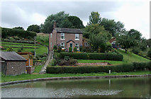 SJ6374 : Cottage with garden by the canal near Barnton, Cheshire by Roger  D Kidd