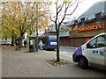 Bus stopping opposite Sainsbury