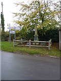 SO4890 : Ticklerton War Memorial and signpost by Richard Law