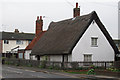 TL9500 : Thatched cottage with weatherboarding by Roger Jones