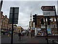 Cyclists and vans on Kingsland Road