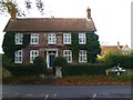 House and signpost at Elsted crossroads