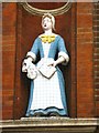 The (former) Raine Street charity school, E1 - Bluecoat girl statue (2)