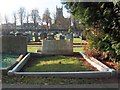 Grave in Norton Cemetery with view to St Peter