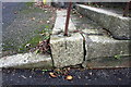 Benchmark at bottom of steps Malpas Road