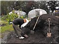 Filling sacks with the (warm) compost