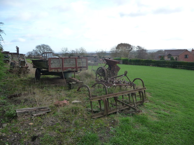 Old farm machinery in a field corner below Silvington Hill