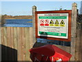 SK9166 : Sign and lake at Whisby Nature Park by PAUL FARMER