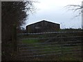 Farm building and gate on Broad Down