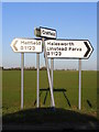 TM3078 : Roadsigns on the B1123 Harleston Road by Geographer