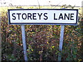 TM2775 : Storeys Lane sign by Geographer