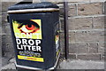 Benchmark beside litter bin outside #86 Old Mill Lane