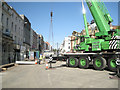 SP3165 : Big green crane lowers a precast wall section by Robin Stott