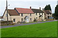 Houses facing the village green, Stone