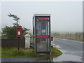 HU5564 : Brough: postbox № ZE2 109 and phone by Chris Downer