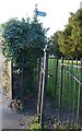 TL0619 : Footpath gateway in churchyard, Caddington by Rob Farrow
