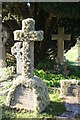 SW7827 : A lichen covered granite cross in Mawnan churchyard by Rod Allday