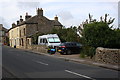 Houses on A684 at east end of West Witton