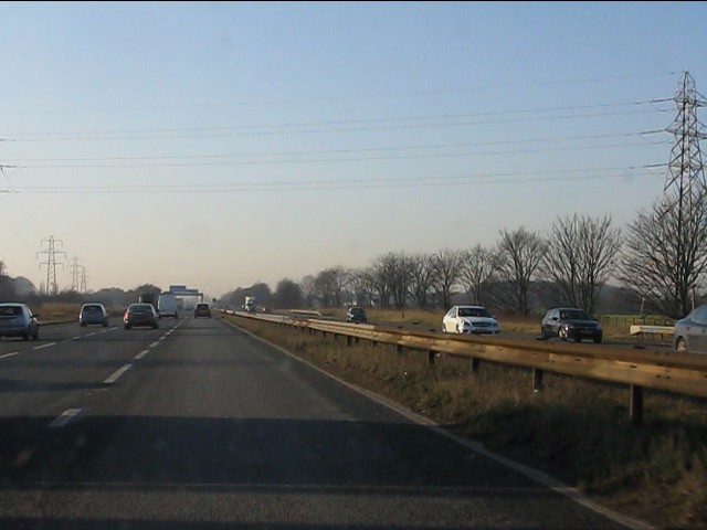 Power lines cross the westbound M62