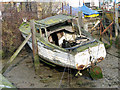 Dilapidated old boat in Belstead Brook, Ipswich