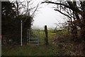 Kissing gate by the sign