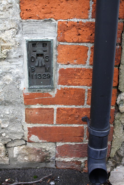 Benchmark on Corner House, Church Green