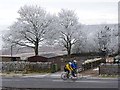 Cyclists passing Weather Hill